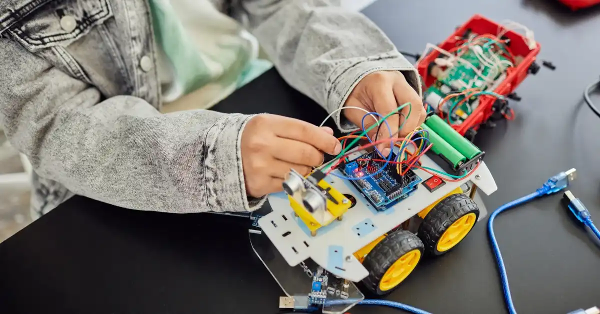 Teen programming in front of computer